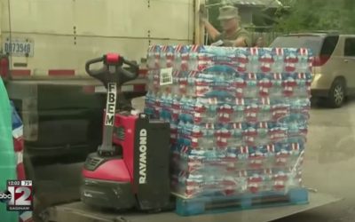 Church water distribution continues to draw large crowds